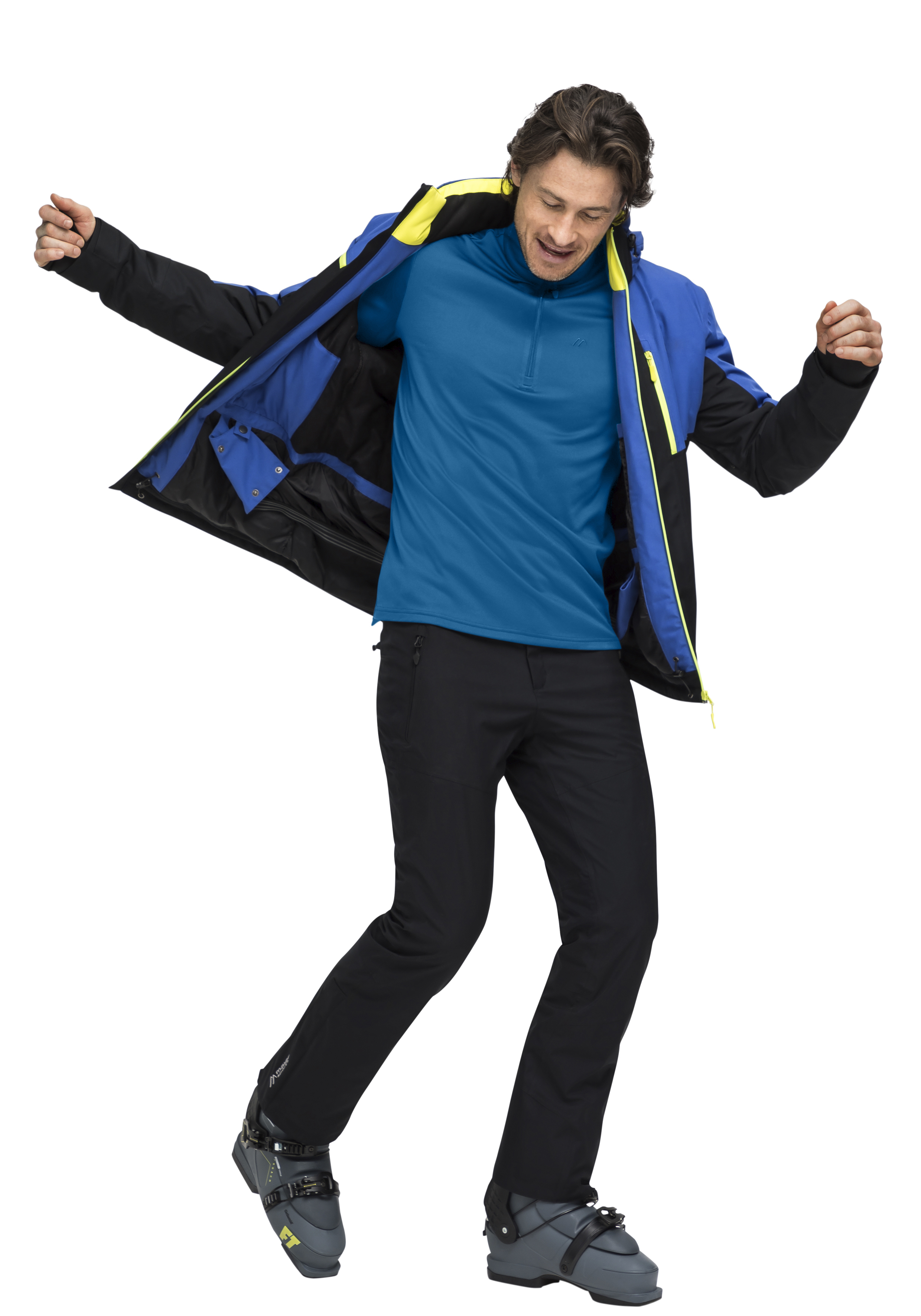 Felix Softshell Jacke, blaue Jacke, schwarze Hose, Skistiefel, mittlere Jacke